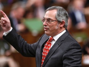 Canada's Treasury Board President Tony Clement speaks during Question Period in the House of Commons on Parliament Hill in Ottawa December 4, 2014. REUTERS/Chris Wattie