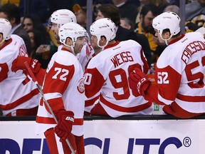 Erik Cole of the Detroit Red Wings is congratulated by teammates after scoring a goal against the Boston Bruins during the second period at TD Garden on March 8, 2015 in Boston. (Maddie Meyer/Getty Images/AFP)