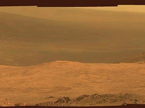 A view from NASA's Mars Exploration Rover Opportunity shows part of "Marathon Valley," a destination on the western rim of Endeavour Crater on the planet Mars, as seen from an overlook north of the valley in this NASA composite handout photo provided March 24, 2015. (REUTERS/NASA/Handout via Reuters)