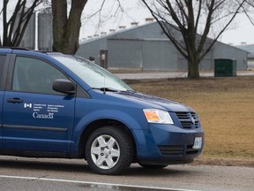 A Canada Food Inspection Agency vehicle sits outside of a turkey farm on Highway 2, one of eight in Oxford County in a containment zone following a bird flu outbreak, west of Woodstock, Ontario on Wednesday April 8, 2015.  The first of the farms where H5 avian influenza was detected was placed under quarantine earlier this week.
CRAIG GLOVER/QMI Agency