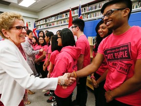 Ontario Premier Kathleen Wynne participates in the "' Day of Pink" assembly at Agincourt Collegiate Institute in Scarborough. (STAN BEHAL, Toronto Sun)