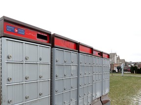 Canada Post is phasing out door-to-door mail delivery. While no changes have been made in downtown Toronto, residents will eventually rely on community mailboxes. (Toronto Sun files)