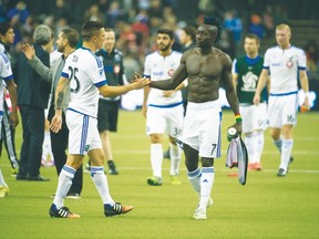 Montreal Impact's Dominic Oduro (right) says that he was racial abused by fans in Costa Rica. (QMI AGENCY)