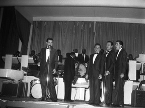 Image by the late Ken Smith, a vocal group and sax player wail at the old London Arena during the "mammoth" rock and roll concert in 1958. The group may be The Diamonds -- and the sax player is possibly Sam (The Man) Taylor. (courtesy of Western Archives)