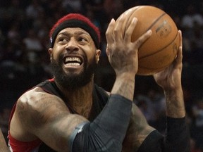 Raptors forward James Johnson's red-coloured hair peeks out from behind his black headband during a game against the Charlotte Hornets on April 8, 2015. (JEREMY BREVARD/USA TODAY Sports)