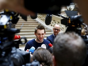 Austrian data activist Max Schrems talks to the media in the courthouse after his trial against Facebook in Vienna April 9, 2015.   REUTERS/Leonhard Foeger
