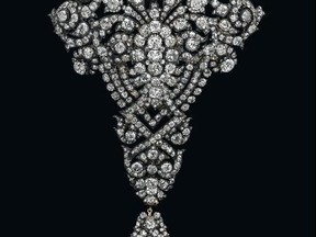 A diamond brooch given by Spain's King Alfonso XII to his wife as a wedding gift and ruby ear pendants once owned by Jacqueline Kennedy Onassis are among highlights of an auction of precious jewels that could fetch more than $80 million, Christie's said on Thursday. (Christie's)