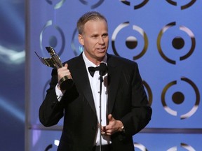 Actor Gerry Dee accepts the awards for best actor in a comedy series role for his work in "Mr. D" at the Canadian Screen Awards in Toronto March 3, 2013.  REUTERS/Mark Blinch