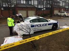 Peel Regional Police are investigating after an officer was stabbed at a Mississauga townhouse complex during a confrontation with a man in his 40s who is believed to suffer from mental health issues. (CHRIS DOUCETTE/Toronto Sun)