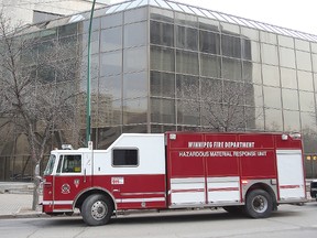 The Winnipeg Fire Department hazardous materials unit sits outside the Law Courts in Winnipeg, Man. Wednesday, April 8, 2015 after the report of a suspicious package.