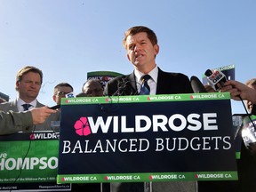 Wildrose leader Brian Jean speaks to the media on the party's balance budget and savings plan during a news conference at the Alberta Legislature in Edmonton, Alberta on Thursday, April 9, 2015.  Perry Mah/Edmonton Sun/QMI Agency