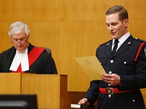 Emily Mountney-Lessard/The Intelligencer
Const. Stephen Cooke is sworn in as a new police officer for the Belleville Police Service, Thursday, at the Ontario Court of Justice. Justice Stephen Hunter presided over the ceremony.