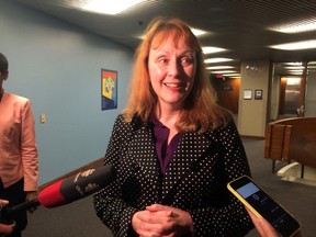 Dr. Suzanne MacDonald, a professor at York University who studies animal behaviour, tested the city's new green bin for seven days, speaks to media following the introduction of the city's new "raccoon-proof" green bins at City Hall on April 9, 2015.(Don Peat/Toronto Sun)