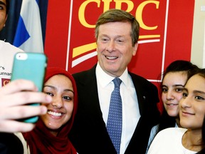 Mayor John Tory is greeted by students looking for selfies with the him on April 9, 2015 during the launch of the CIBC Trophy Mayor's School Cricket Tournament 2015 at City Hall. (Veronica Henri/Toronto Sun)