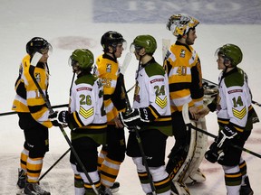 Members of the Kingston Frontenacs shake hands with North Bay Battalion players following North Bay’s four-game sweep of the Frontenacs in an Ontario Hockey League first-round playoff series at the Rogers K-Rock Centre on April 2. (Annie Sakkab/For The Whig-Standard)