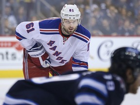 New York Rangers forward Rick Nash awaits the puck drop during NHL action against the Winnipeg Jets at MTS Centre in Winnipeg, Man., on Tues., March 31, 2015. Kevin King/Winnipeg Sun/QMI Agency