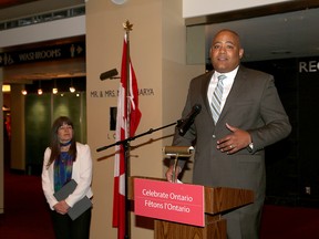 Michael Coteau, Ontario Minister of Tourism and Sport, makes a tourism funding announcement while Kingston and the Islands MPP Sophie Kiwala looks on Thursday at the Grand Theatre. (Ian MacAlpine/The Whig-Standard)