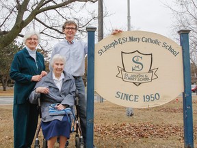 Three generations of teachers, Sister Pauline Lally, standing, John Corrigan and Sister Julia Hamilton, who was on staff in 1949, pose for a photo outside St. Joseph/St. Mary Catholic School on Napier Street. (Julia McKay/The Whig-Standard)