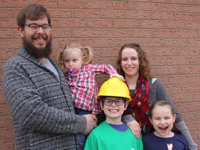 Davis family, of Wallaceburg, Ont., can hardly wait to move into their own brand new home, which is expected to be built by the fall. Ryan Davis, his wife Becca, and their children Isaac, 8, April, 7, and Olive, 2, have been selected as the partner family for Habitat for Humanity Chatham-Kent's 2015 home build. This is the second home to be built since the organization began in 2009. (Ellwood Shreve/Chatham Daily News/QMI Agency)