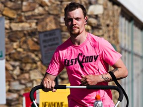 "Fast Eddy" Dostaler is seen at Jasper Avenue and 117 Street in Edmonton, Alta., on Thursday, April 9, 2015. Dostaler is running across the country and back with no support team to raise money and awareness for Alzheimer's and breast cancer. Dostaler, who began this journey on March 1 and has logged 1694 kilometres so far.
