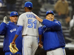 Toronto Blue Jays manager John Gibbons (5) congratulates relief pitcher Miguel Castro (51) on April 9, 2015, after the Blue Jays defeated the New York Yankees 6-3 at Yankee Stadium. (ADAM HUNGER/USA TODAY Sports)