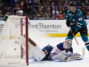 Edmonton's goalie Laurent Brossoit (1) can't stop San Jose's Patrick Marleau (12), not pictured, from scoring as Tomas Hertl (48) looks on during the third period of the Edmonton Oilers' NHL hockey game against the San Jose Sharks at Rexall Place in Edmonton, Alta., on Thursday, April 9, 2015. The Sharks won 3-1. Codie McLachlan/Edmonton Sun