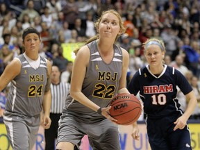 Lauren Hill of Mount St. Joseph shoots to score her second basket during the game against Hiram at Cintas Center on November 2, 2014 in Cincinnati, Ohio. Hill, a freshman, has terminal cancer and this game was granted a special waiver by the NCAA to start the season early so she could play in a game.  Andy Lyons/Getty Images/AFP