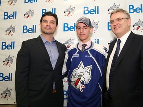 Israeli-born hockey star David Levin, middle, poses with Wolves' coach David Matsos, left, and Blaine Smith, president and GM of the Sudbury Wolves, at a press conference in April. John Lappa/The Sudbury Star