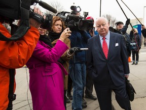 Former Senator Mike Duffy is pursued by  journalists as he leaves the Ottawa Courthouse on Thursday April 9, 2015. Errol McGihon/Ottawa Sun/QMI Agency
