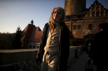 A participant smiles as he walks in front of the castle before the role play event at Czocha Castle in Sucha, west southern Poland April 9, 2015.Harry Potter enthusiasts from all over the world are attending a four-day live action role play event at the medieval castle made into a close imitation of the 'College of Wizardry'. REUTERS/Kacper Pempel