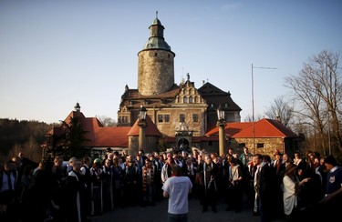 Participants gather in front of the castle to listen instructions before the role play event at Czocha Castle in Sucha, west southern Poland April 9, 2015. Harry Potter enthusiasts from all over the world are attending a four-day live action role play event at the medieval castle made into a close imitation of the 'College of Wizardry'. REUTERS/Kacper Pempel