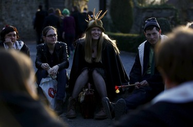 Participants smile as they take part in workshop before the role play event at Czocha Castle in Sucha, west southern Poland April 9, 2015. Harry Potter enthusiasts from all over the world are attending a four-day live action role play event at the medieval castle made into a close imitation of the 'College of Wizardry'. REUTERS/Kacper Pempel