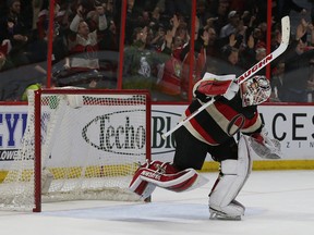 Ottawa Senators goalie Andrew Hammond celebrates his teams overtime goal against the Tampa Bay Lightning at the Canadian Tire Centre in Ottawa Thursday April 2,  2015. The Ottawa Senators defeated the Tampa Bay Lightning 2-1 in overtime. Tony Caldwell/Ottawa Sun/QMI Agency