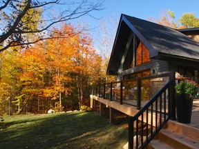 Colin and Justin's pride and joy is the deck that wraps around their lakeside hideaway.