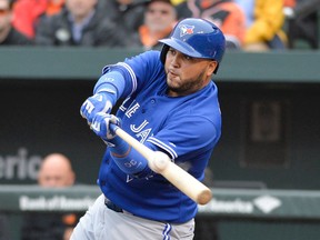 Blue Jays catcher Dioner Navarro hits a two-run double during first inning MLB action against the Orioles in Baltimore on Friday, April 10, 2015. (Tommy Gilligan/USA TODAY Sports)