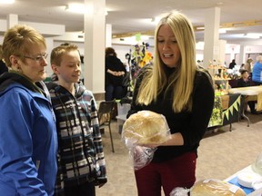 Belinda Watling and her son Gabe are regular shoppers at the Stony Plain Farmers’ Market and made sure to visit Lee Scantlebury’s table on April 4. - Karen Haynes, Reporter/Examiner