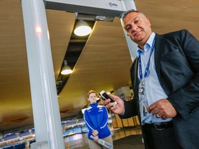 Rogers Centre, VP of stadium operations and security, Mario Coutinho, shows the new metal detectors installed at the Rogers Centre on April 10, 2015. (Dave Thomas/Toronto Sun)