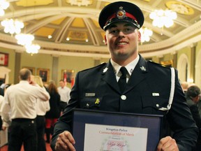 Kingston native Const. Kyle Lloyd of the Durham Regional Police Service with his Community Commendation of Merit Award presented to him at the Kingston Police Awards Ceremony on Thursday.
Steph Crosier/The  Whig-Standard