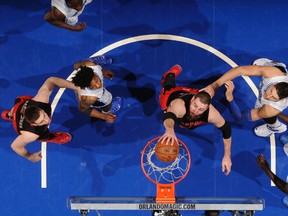 Raptors’ Jonas Valanciunas throws down a dunk against the Magic in Orlando last night. The Raptors won 101-99.(AFP)