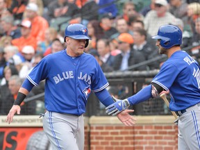 Toronto Blue Jays third baseman Josh Donaldson (left) and centre fielder Kevin Pillar both had a key defensive play in their team's 12-5 victory over the Baltimore Orioles at Oriole Park at Camden Yards on April 10, 2015. (TOMMY GILLIGAN/USA TODAY Sports)