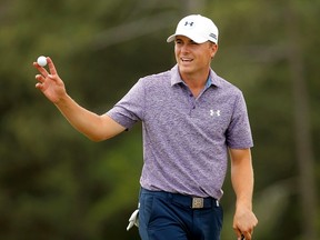 Jordan Spieth waves to the gallery after finishing on the 18th green at 14-under par during the second round of the Masters at Augusta National Golf Course in Augusta, Ga., on Friday, April 10, 2015. (Brian Snyder/Reuters)