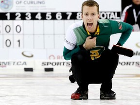 Skip Brendan Bottcher crouches during his team's game against Kevin Koe at the Players' Championship curling event at Mattamy Athletic Centre in Toronto on April 10, 2015. (VERONICA HENRI/Toronto Sun)