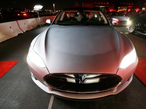 New all-wheel-drive versions of the Tesla Model S car are lined up for test drives in Hawthorne, California in this file photo from October 9, 2014.  (REUTERS/Lucy Nicholson/Files)