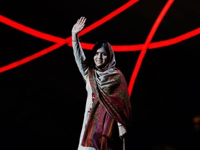 Nobel Peace Prize laureate Malala Yousafzai waves as she arrives on stage at the Nobel Peace Prize Concert in Oslo December 11, 2014. REUTERS/Suzanne Plunkett