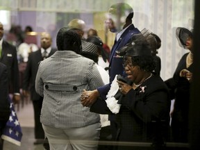 Judy Scott weeps as she is escorted in for the funeral of her son, Walter Scott, at W.O.R.D. Ministries Christian Center, Saturday, April 11, 2015, in Summerville.  REUTERS/David Goldman/Pool