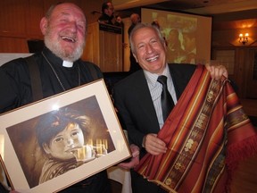 Padre Pio travelled all the way from Ecuador to thank Edmonton’s Dr. John Di Toppa, vice president of the Canadian Volunteers for International Development Society (CVIDS). The local organization sends medical teams to serve the underprivileged in South America each year. PHOTO SUPPLIED