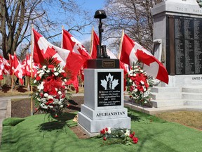 158 flags, each representing on Canadian felled while in service in Aghanistan, mark a memorial in Woodstock