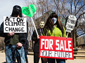Protesters gather during a rally at the Alberta Legislature Building held in solidarity with Quebec City's Act on Climate march in Edmonton, Alta., on Saturday, April 11, 2015. Codie McLachlan/Edmonton Sun/QMI Agency