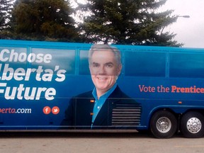 Alberta premier Jim Prentice gives a thumbs up as he gets on his bus after Prentice had called a provincial election at Crestwood Hall in Edmonton, Alta., on Tuesday April 7, 2015. Prentice was heading west on Yellowhead Highway for several election stops on Tuesday. Tom Braid/Edmonton Sun/QMI Agency