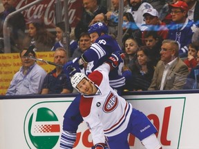 Leafs tough guy Colton Orr gets hit by Montreal Canadiens’ Brandon Prust during Saturday night’s game at the ACC.